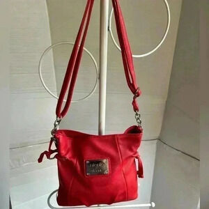 Nicole Miller coral shoulder bag.